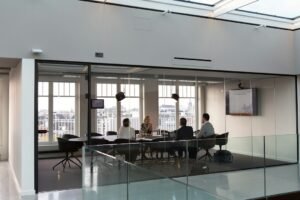 Foreign investors and advisers reviewing corporate bank account documents in a modern office